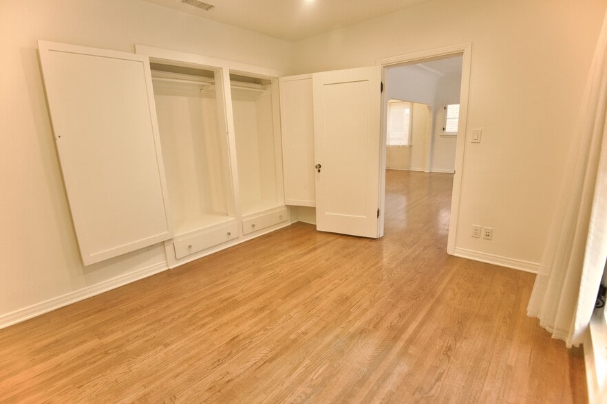 Bedroom 1 off Living Room, double closets with storage below - 4755 Wiota St