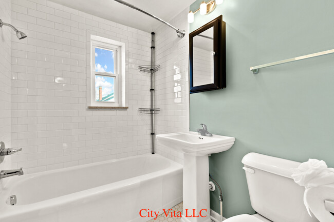 Updated bathroom with ceramic subway tile - 69 N 20th St