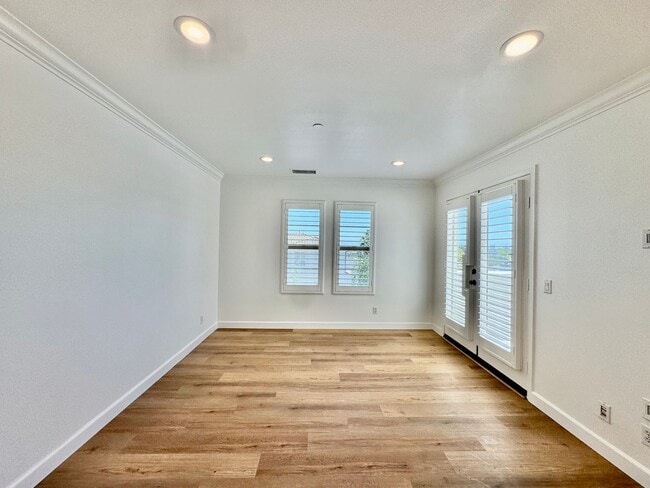 Building Photo - Beautifully Remodel Townhouse with AC & Two Car Garage!