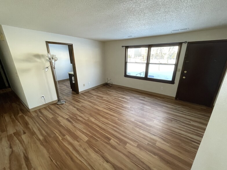 Entry to living room from common area/laundry room, into living room. - 717 Westgate St