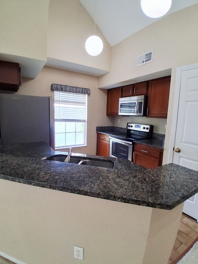 Building Photo - Water view condo with garage in sought after westchase