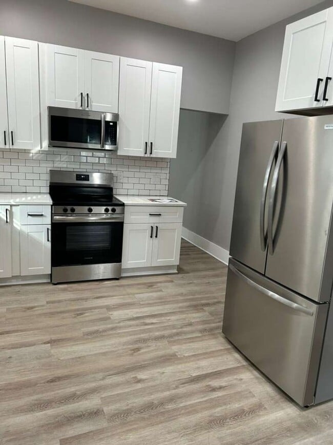 Building Photo - MOVE IN SPECIAL - Modern, Chic and brand new 2 bedroom with an office -   Discover This Home That...