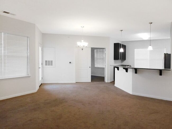 Building Photo - Pet Friendly Condo with Deck and 1 Car Garage