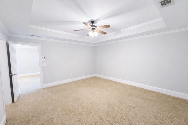 Building Photo - Gated Johns Creek Townhome Offering Space, Privacy, and Everyday Convenience