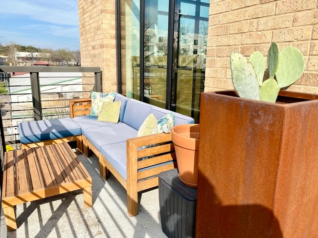 The balcony extends to include a spacious outdoor sofa. - 1501 E 4th St