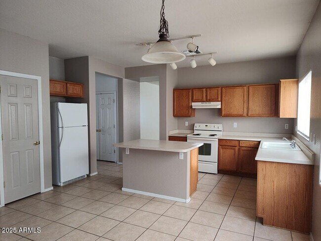 Building Photo - 16181 W Gelding Dr