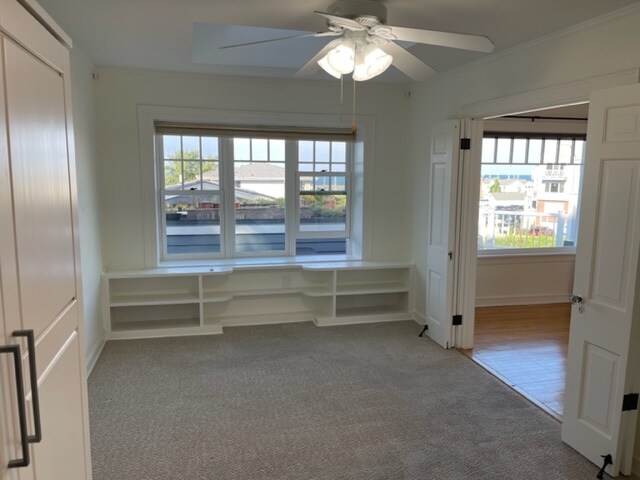 Main Bedroom w lake views & flex floorplan. French doors, built-in shelves, wardrobe & skylight. - 2650 S Shore Dr