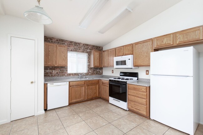 Building Photo - Two bedroom townhome with garage in gated ...
