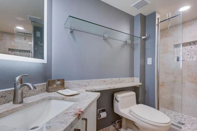 Building Photo - Newly Renovated Beachfront Condo with Stun...