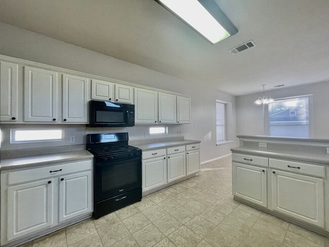Building Photo - Spacious Home with Multiple Outdoor Living...