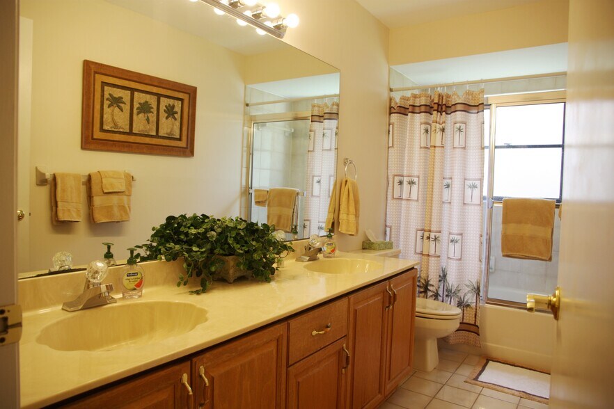 Shared bath has dual sink vanities and tub/shower. - 2662 NW 42nd St