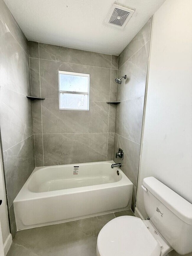 Building Photo - GORGEOUS, Large Completely Renovated Two-Story 4/2.5 PLUS LOFT in POINCIANA VILLAGES!