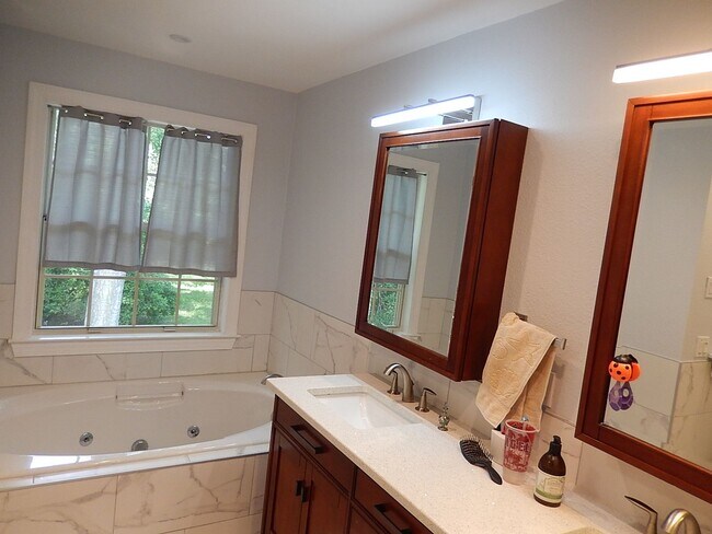 Building Photo - GORGEOUS NE 4/2.5 on 1 Acre w/ Fenced Yard, Garage, Washer/Dryer, Spa Tub, Stainless Appliances, ...
