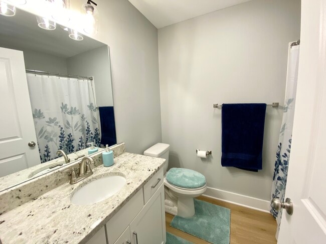 Master bath with ceramic tile shower and granite counter tops. - 140 Sunburst Villa Dr