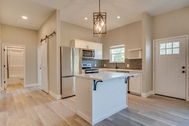 Building Photo - Fully Remodeled 2BR/2BA Attached Home with Garage, Modern Finishes, Park Views & Prime Downtown P...