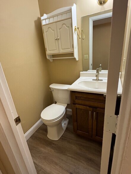 Downstairs half bath - 9109 Parktop Ln