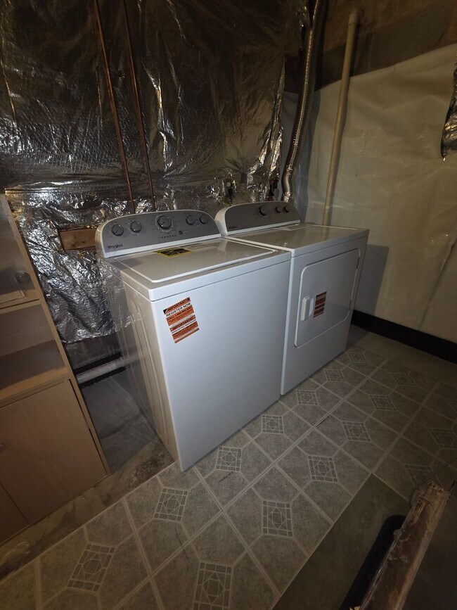 Building Photo - Serene Living in a Quiet Lakeside Community