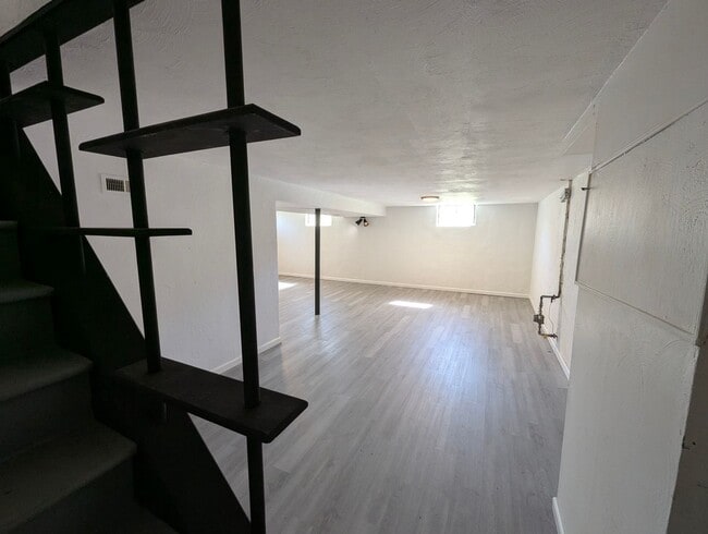 Building Photo - Updated Open-Concept with Sunroom & Finished Basement Space