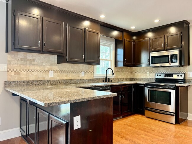 Building Photo - SPACIOUS INSIDE AND OUT!