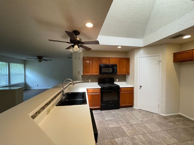 Building Photo - SPACIOUS HOME - NEW FLOORING! - 2 LIVING A...