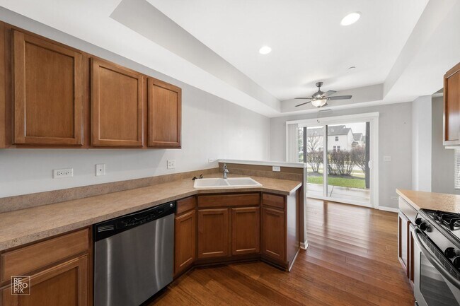 Building Photo - Yorkville First Floor End Unit Two Bed Condo with Pond Views