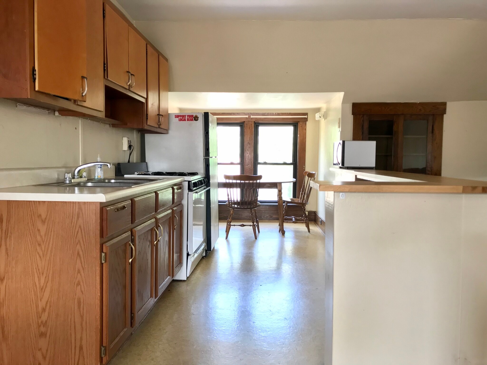 (from entry stairway) Plenty of storage and gas stove in eat-in kitchen - 350 Cobun Avenue