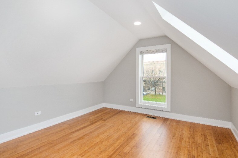 Bright bedroom with skylight. - 1337 W. Walton