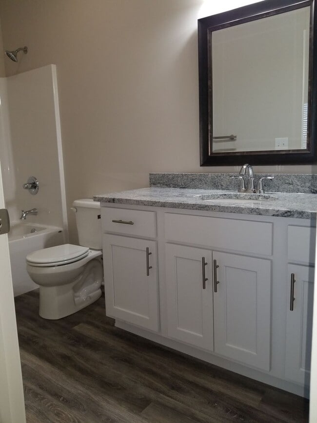 Building Photo - Daylight ranch townhome with 2 stall garage.  Private driveway and covered deck. high end finishe...