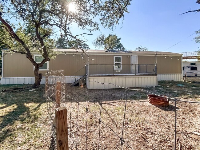 Building Photo - Move-In Ready Home Near Canyon Lake – Fresh Interior, Deck & Detached Garage