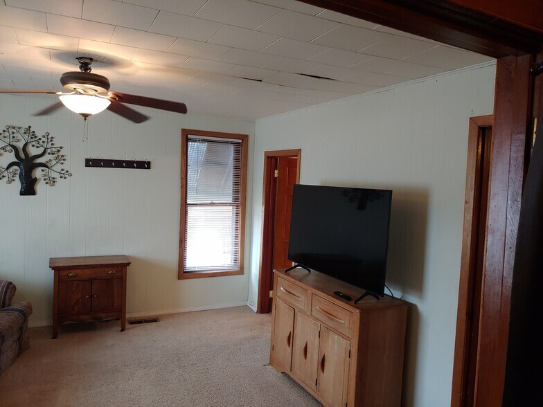 living room with 55" Samsung 4K smart TV - 1146 Howard St