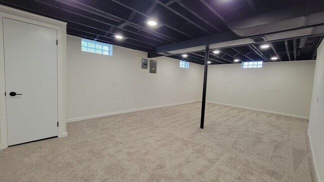 Partially finished basement with new carpeting, paint, trim, lighting and remodeled bathroom.. - 6305 49th Ave