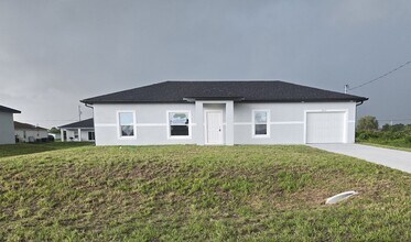 Building Photo - BRAND NEW THREE BEDROOM, 2 BATH, 1 CAR GAR...