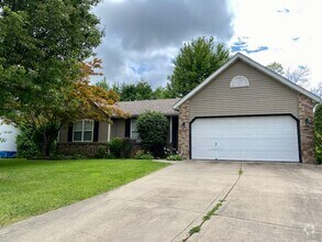 Building Photo - Three Bedroom Home w/ 2.5 Baths and 2 Car ...