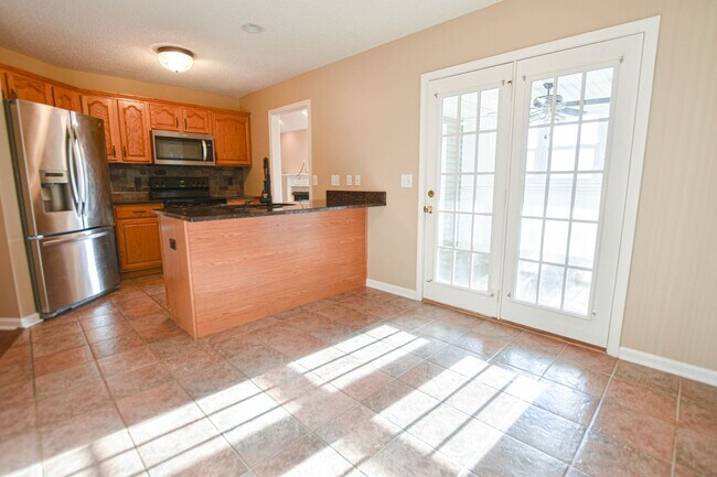 Building Photo - Pet Friendly Three Bedroom with Bonus!