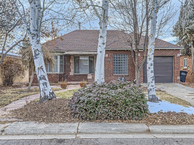 Building Photo - Evolve Real Estate: Available 8/8/26 Brick Tudor with Large Yard and Finished Basement!