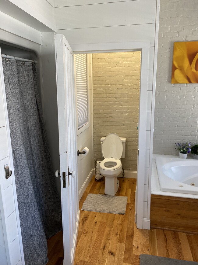 Separate toilet room, stand up shower, and tub - 100 1/2 S Pendleton St