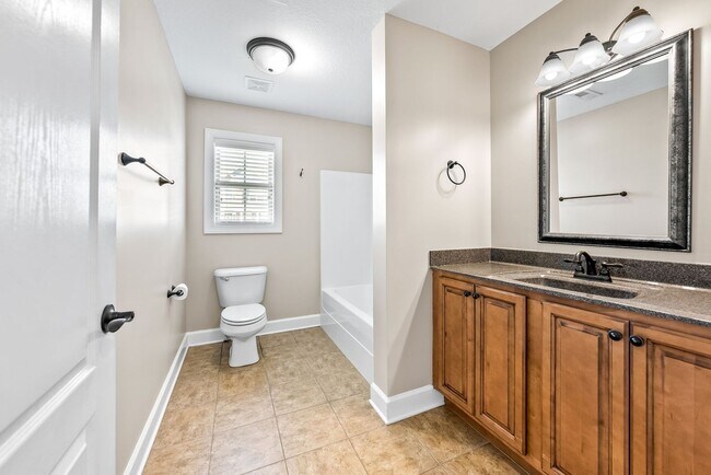 Building Photo - Pet Friendly Three Bedroom with Bonus!