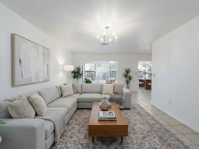 Building Photo - Recently painted 4BR/3BA home with tile floors throughout, fenced yard, detached garage, and prim...