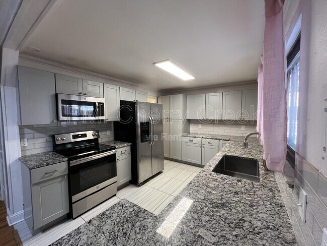 Building Photo - 12517 E 31st Ave