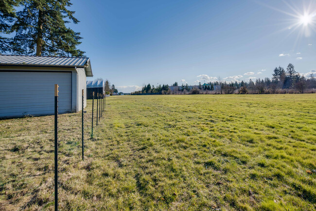 Building Photo - 4 Bedroom 3 Bath Home -  EVERGREEN AIRPARK...