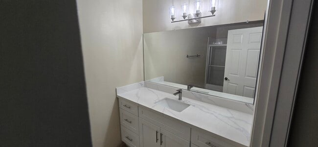 New light fixture over wall-to-wall mirror - 14365 Foothill Blvd