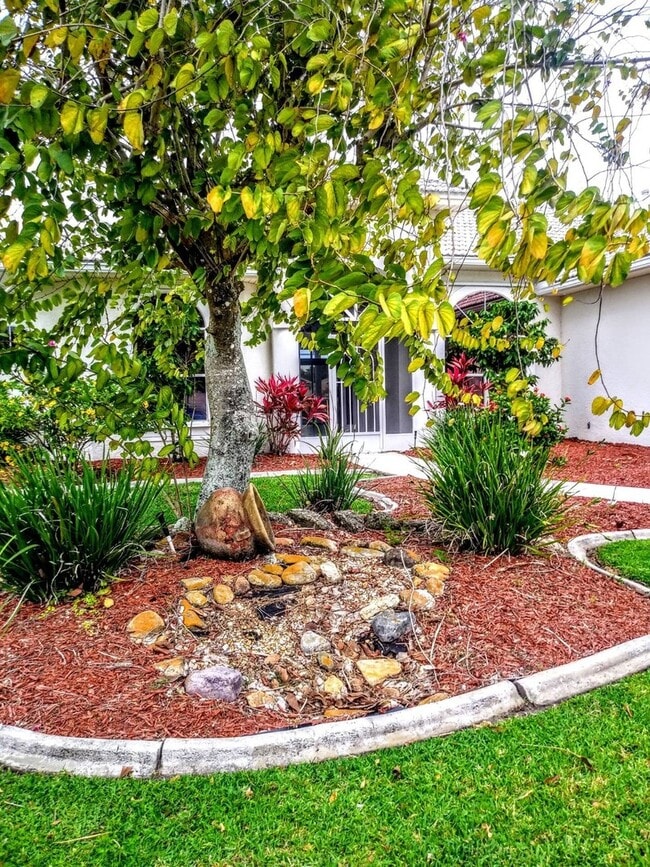 Building Photo - ENJOY LIFE IN THIS 4 BEDROOM UNIQUE LAKE V...