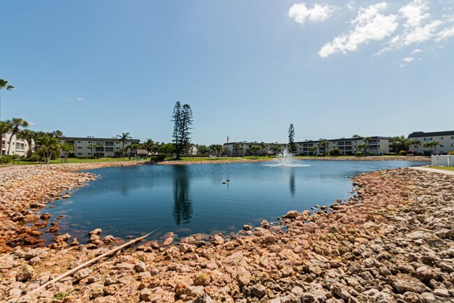 Building Photo - AVAILABLE NOW! Furnished Ground-Floor End Unit | Lake & Pool Views | Minutes to Marco Island & Do...