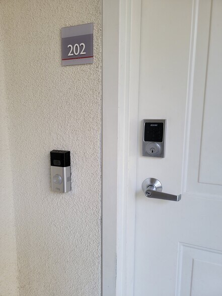 Front door with Ring Doorbell and Schlage Deadbolt - 12655 Bluff Creek Dr