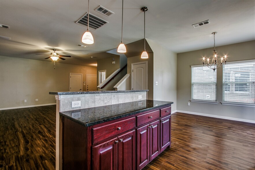 Kitchen Island- Cherrywood cabinets and granite countertop - 4917 Sanger Circle