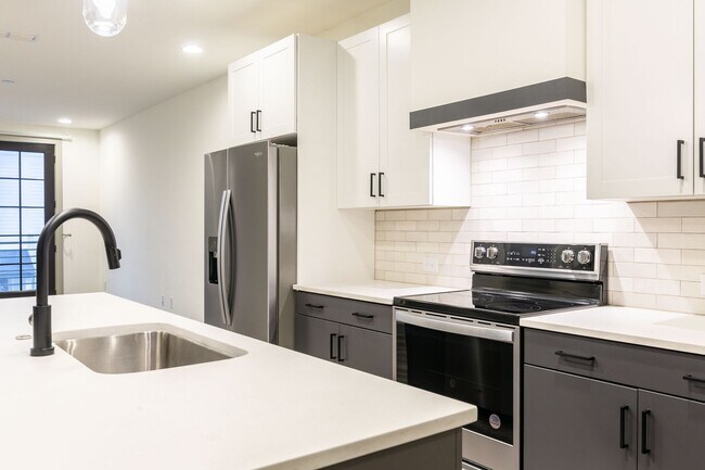Building Photo - Modern Living Meets Walkable City Charm in...