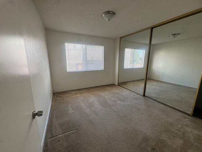 Building Photo - $2,395! Spacious Upstairs 2 Bedroom, 2 Bathroom Apartment with 2-Car Garage! 90710