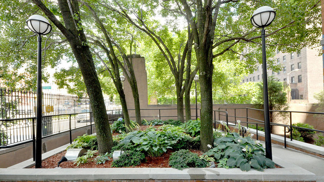 photo of Plaza West Garden in daytime outside building Entrance - Plaza West