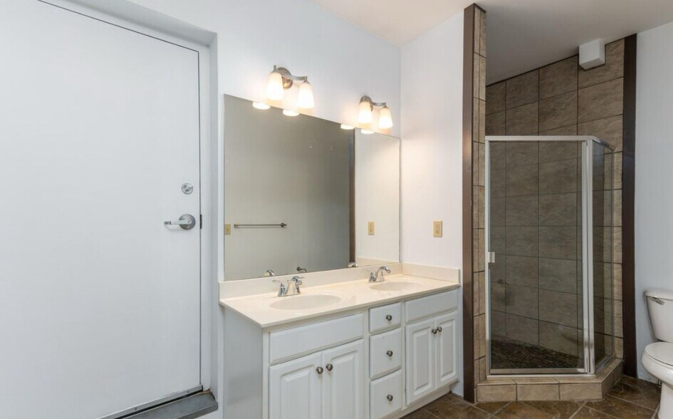 second floor bath - has shower with rain showered and separate bathtub - 400 E Main St