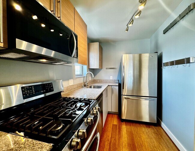 Building Photo - Corner Light. City Energy. Zero Compromise.